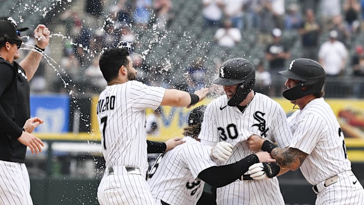 Chicago White Sox first baseman Tim Elko (30) celebrated with teammates after hitting a walk-off single against the Detroit Tigers at Rate Field. Chicago White Sox first baseman Tim Elko (30) celebrated with teammates after hitting a walk-off single against the Detroit Tigers at Rate Field.