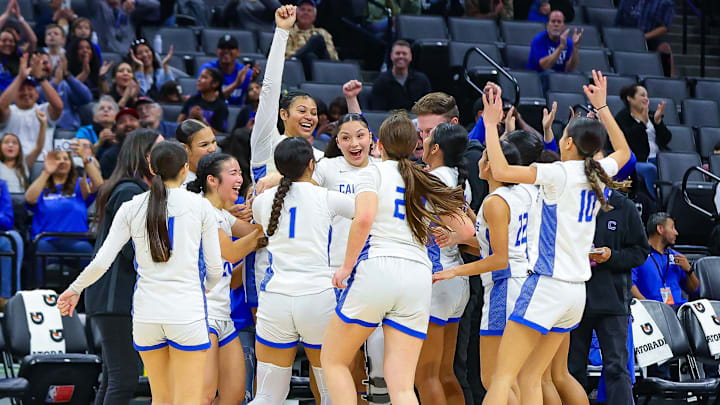 Caruthers players celebrate winning the California (CIF) State Division 2 championship at the Golden 1 Center in Sacramento.