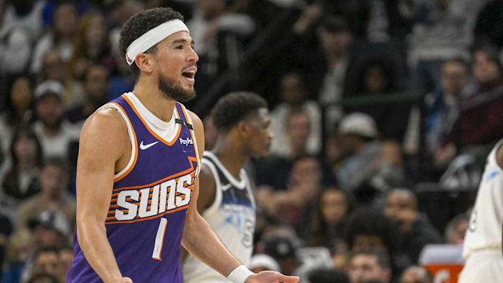 Nov 17, 2024; Minneapolis, Minnesota, USA;  Phoenix Suns guard Devin Booker (1) reacts after being called for a foul against the Minnesota Timberwolves during the fourth quarter at Target Center. Mandatory Credit: Nick Wosika-Imagn Images