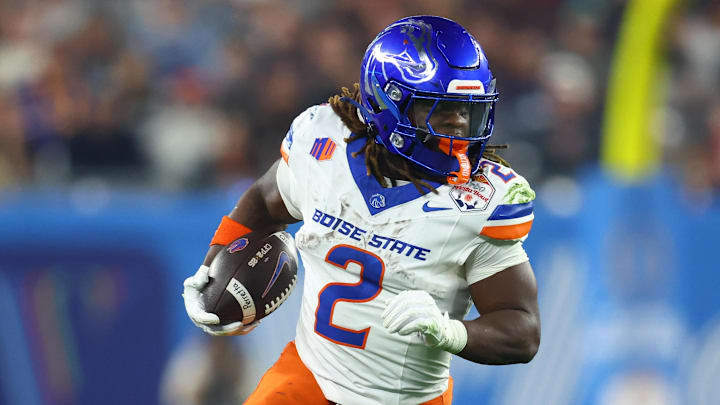 Dec 31, 2024; Glendale, AZ, USA; Boise State Broncos running back Ashton Jeanty (2) rushes the ball against the Penn State Nittany Lions during the first half in the Fiesta Bowl at State Farm Stadium. Mandatory Credit: Mark J. Rebilas-Imagn Images