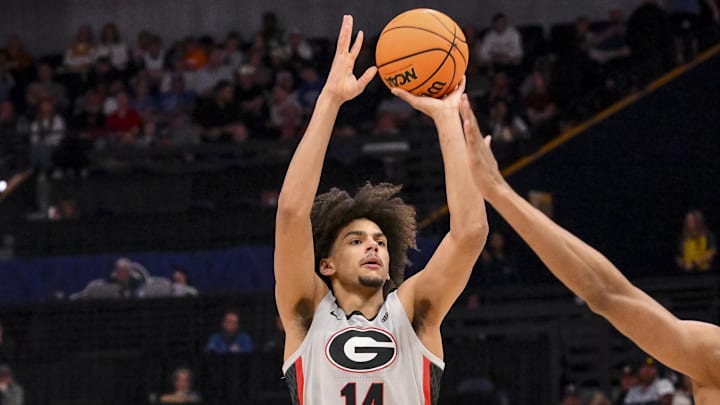 Mar 12, 2025; Nashville, TN, USA; Georgia Bulldogs forward Asa Newell (14) shoots a three point basket against the Oklahoma Sooners during the first half at Bridgestone Arena. Mandatory Credit: Steve Roberts-Imagn Images Mar 12, 2025; Nashville, TN, USA; Georgia Bulldogs forward Asa Newell (14) shoots a three point basket against the Oklahoma Sooners during the first half at Bridgestone Arena. Mandatory Credit: Steve Roberts-Imagn Images
