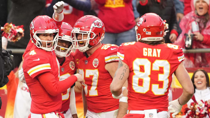 Jan 21, 2023; Kansas City, Missouri, USA; Kansas City Chiefs tight end Travis Kelce (87) celebrates his touchdown scored against the Jacksonville Jaguars with quarterback Chad Henne (4) and tight end Noah Gray (83) during the first half in the AFC divisional round game at GEHA Field at Arrowhead Stadium. Mandatory Credit: Jay Biggerstaff-USA TODAY Sports