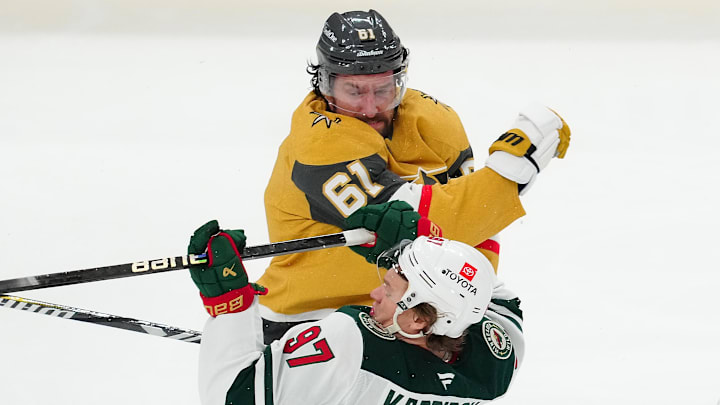 Apr 22, 2025; Las Vegas, Nevada, USA; Vegas Golden Knights right wing Mark Stone (61) checks Minnesota Wild left wing Kirill Kaprizov (97) during the third period of game two of the first round of the 2025 Stanley Cup Playoffs at T-Mobile Arena. Mandatory Credit: Stephen R. Sylvanie-Imagn Images