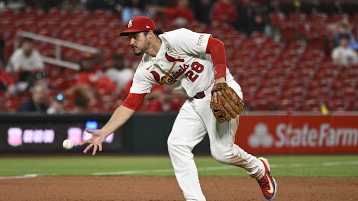 Sep 15, 2025; St. Louis, Missouri, USA; St. Louis Cardinals third baseman Nolan Arenado (28) fields a ground ball hit by Cincinnati Reds third baseman Santiago Espinal (not pictured) in the ninth inning at Busch Stadium. Mandatory Credit: Joe Puetz-Imagn Images