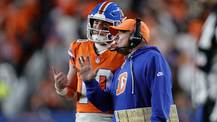 Nov 6, 2025; Denver, Colorado, USA; Denver Broncos head coach Sean Payton talks with quarterback Bo Nix (10) during the second half at Empower Field at Mile High. 