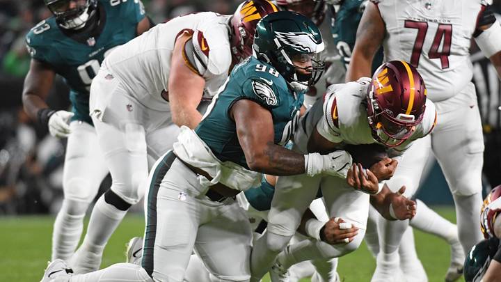 Nov 14, 2024; Philadelphia, Pennsylvania, USA; Washington Commanders quarterback Jayden Daniels (5) is tackled by Philadelphia Eagles defensive tackle Jalen Carter (98) during the first quarter at Lincoln Financial Field. Mandatory Credit: Eric Hartline-Imagn Images Nov 14, 2024; Philadelphia, Pennsylvania, USA; Washington Commanders quarterback Jayden Daniels (5) is tackled by Philadelphia Eagles defensive tackle Jalen Carter (98) during the first quarter at Lincoln Financial Field. Mandatory Credit: Eric Hartline-Imagn Images