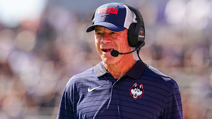 Aug 30, 2025; East Hartford, Connecticut, USA; Connecticut Huskies head coach Jim Mora watches from the sideline as they take on the Central Connecticut State Blue Devils at Pratt & Whitney Stadium at Rentschler Field. Mandatory Credit: David Butler II-Imagn Images Aug 30, 2025; East Hartford, Connecticut, USA; Connecticut Huskies head coach Jim Mora watches from the sideline as they take on the Central Connecticut State Blue Devils at Pratt & Whitney Stadium at Rentschler Field. Mandatory Credit: David Butler II-Imagn Images