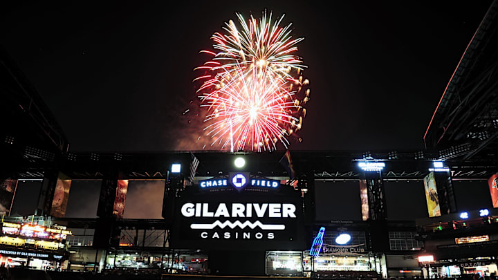 Jul. 4, 2012; Phoenix, AZ, USA; Fans sit on the field and watch a fireworks show after the game. Arizona Diamondbacks hosted the San Diego Padres at Chase Field.  The Padres defeated the Diamondbacks 8-6. Mandatory Credit: Jennifer Stewart-Imagn Images
