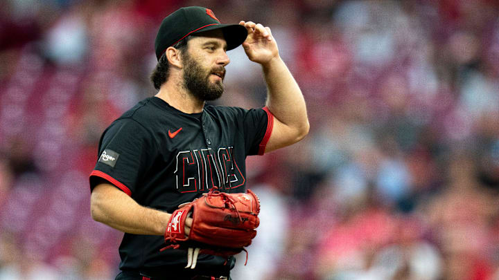 Cincinnati Reds pitcher Sam Moll (50) adjusts his cap while pitching in the fifth inning of the MLB game between the Cincinnati Reds and Milwaukee Brewers at Great American Ball Park in Cincinnati on Friday, Aug. 30, 2024.