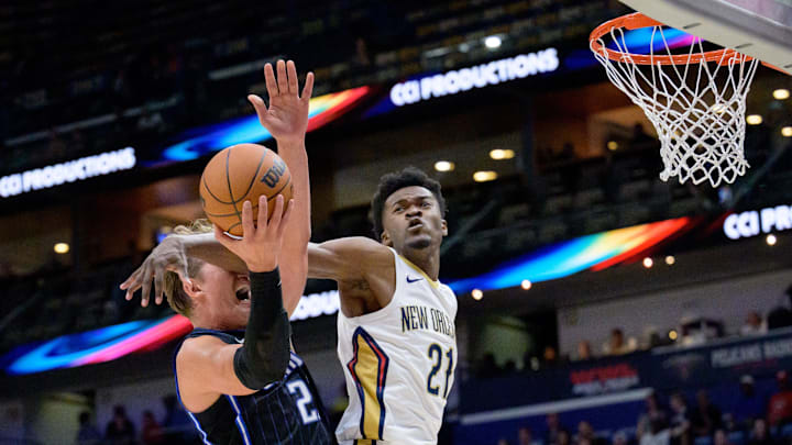 Oct 7, 2024; New Orleans, Louisiana, USA; New Orleans Pelicans center Yves Missi (21) fouls Orlando Magic center Moritz Wagner (21) during the first half at Smoothie King Center.