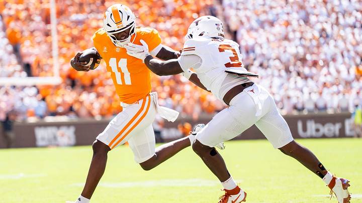 Sep 26, 2026; Knoxville, Tennessee, USA; Tennessee quarterback Faizon Brandon (11) tries to outrun Texas linebacker Rasheem Biles (3) during a college football game between Tennessee and Texas at Neyland Stadium in Knoxville, Tenn. on Sept. 26, 2026. Mandatory Credit: Brianna Paciorka-USA TODAY Network via Imagn Images Sep 26, 2026; Knoxville, Tennessee, USA; Tennessee quarterback Faizon Brandon (11) tries to outrun Texas linebacker Rasheem Biles (3) during a college football game between Tennessee and Texas at Neyland Stadium in Knoxville, Tenn. on Sept. 26, 2026. Mandatory Credit: Brianna Paciorka-USA TODAY Network via Imagn Images