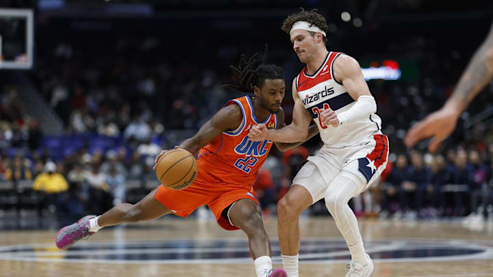 Jan 12, 2025; Washington, District of Columbia, USA; Oklahoma City Thunder guard Cason Wallace (22) drives to the basket as Washington Wizards forward Corey Kispert (24) defends in the fourth quarter at Capital One Arena. Mandatory Credit: Geoff Burke-Imagn Images Jan 12, 2025; Washington, District of Columbia, USA; Oklahoma City Thunder guard Cason Wallace (22) drives to the basket as Washington Wizards forward Corey Kispert (24) defends in the fourth quarter at Capital One Arena. Mandatory Credit: Geoff Burke-Imagn Images