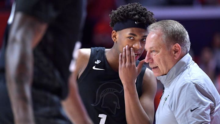 Feb 15, 2025; Champaign, Illinois, USA;  Michigan State Spartans guard Jefremy Fears Jr. (1) talks with Michigan State Spartans head coach Tom Izzo during the second half against the Illinois Fighting Illini at State Farm Center. Mandatory Credit: Ron Johnson-Imagn Images