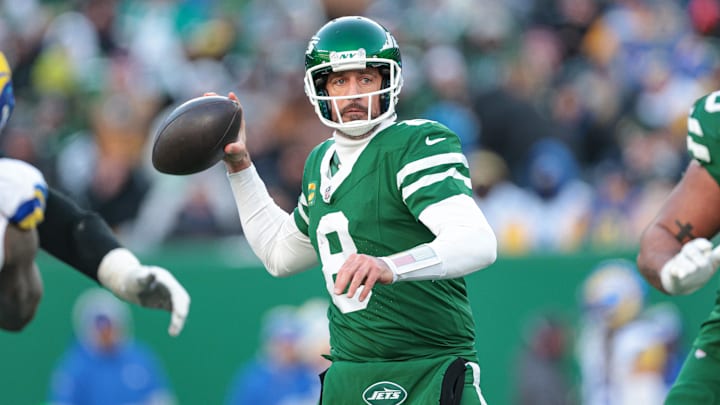 Dec 22, 2024; East Rutherford, New Jersey, USA; New York Jets quarterback Aaron Rodgers (8) throws the ball during the second half against the Los Angeles Rams at MetLife Stadium. Mandatory Credit: Vincent Carchietta-Imagn Images