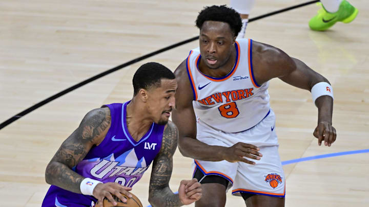 Nov 23, 2024; Salt Lake City, Utah, USA; Utah Jazz forward/center John Collins (20) dribbles the ball against New York Knicks forward/guard OG Anunoby (8) during the second half at the Delta Center. Mandatory Credit: Christopher Creveling-Imagn Images Nov 23, 2024; Salt Lake City, Utah, USA; Utah Jazz forward/center John Collins (20) dribbles the ball against New York Knicks forward/guard OG Anunoby (8) during the second half at the Delta Center. Mandatory Credit: Christopher Creveling-Imagn Images