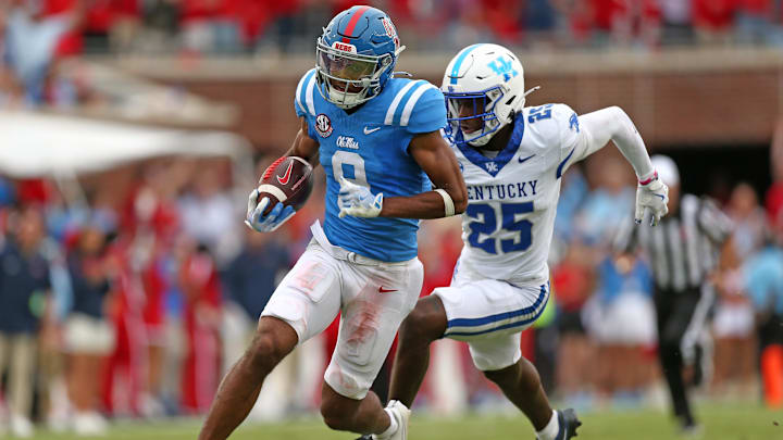 Mississippi Rebels wide receiver Tre Harris runs after a catch for a first down as Kentucky Wildcats defensive back Jordan Lovett pursues during the second half at Vaught-Hemingway Stadium. Mississippi Rebels wide receiver Tre Harris runs after a catch for a first down as Kentucky Wildcats defensive back Jordan Lovett pursues during the second half at Vaught-Hemingway Stadium.