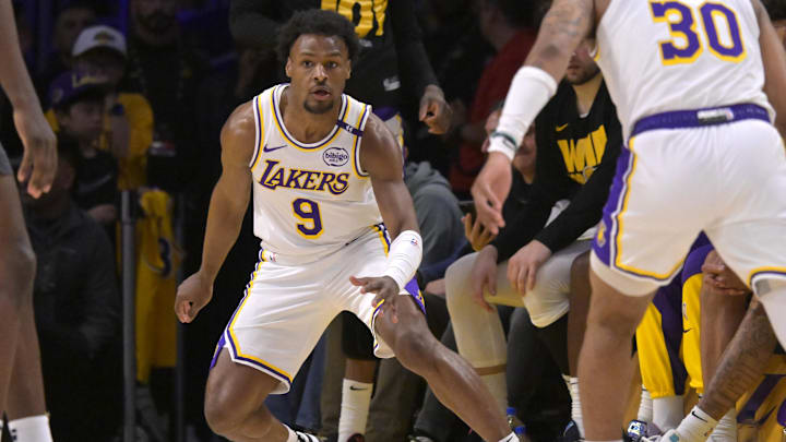 Apr 19, 2025; Los Angeles, California, USA; Los Angeles Lakers guard Bronny James (9) defends on the court in the second half against the Minnesota Timberwolves at Crypto.com Arena. Mandatory Credit: Jayne Kamin-Oncea-Imagn Images