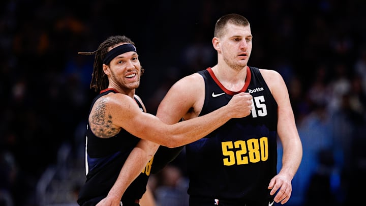 Dec 18, 2023; Denver, Colorado, USA; Denver Nuggets forward Aaron Gordon (50) reacts with center Nikola Jokic (15) in the third quarter against the Dallas Mavericks at Ball Arena. Mandatory Credit: Isaiah J. Downing-Imagn Images