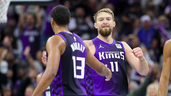 Nov 15, 2024; Sacramento, California, USA; Sacramento Kings forward Domantas Sabonis (11) shakes hands with forward Keegan Murray (13) during the fourth quarter against the Minnesota Timberwolves at Golden 1 Center.