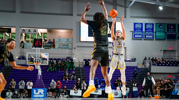 Montverde Academy Eagles guard Dante Allen (30) shoots the ball during the third quarter of the City of Palms Classic semifinal game against the Oak Ridge Pioneers at Suncoast Credit Union Arena in Fort Myers, Fla., on Saturday, Dec. 21, 2024. Montverde Academy Eagles guard Dante Allen (30) shoots the ball during the third quarter of the City of Palms Classic semifinal game against the Oak Ridge Pioneers at Suncoast Credit Union Arena in Fort Myers, Fla., on Saturday, Dec. 21, 2024.