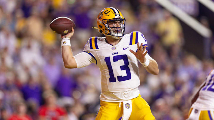 Oct 12, 2024; Baton Rouge, Louisiana, USA;  LSU Tigers quarterback Garrett Nussmeier (13) drops back to pass against the Mississippi Rebels during the first half at Tiger Stadium. Mandatory Credit: Stephen Lew-Imagn Images