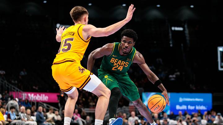 Mar 10, 2026; Kansas City, MO, USA; Baylor Bears guard Tounde Yessoufou (24) drives against Arizona State Sun Devils guard Noah Meeusen (15) during the second half at T-Mobile Center. Mandatory Credit: William Purnell-Imagn Images