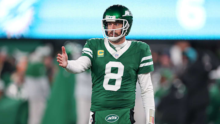 Jan 5, 2025; East Rutherford, New Jersey, USA; New York Jets quarterback Aaron Rodgers (8) gestures towards the Miami Dolphins bench during the second half at MetLife Stadium. Jan 5, 2025; East Rutherford, New Jersey, USA; New York Jets quarterback Aaron Rodgers (8) gestures towards the Miami Dolphins bench during the second half at MetLife Stadium.