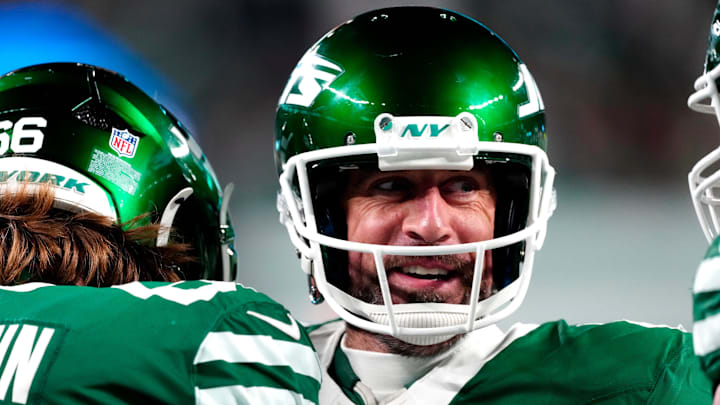 New York Jets quarterback Aaron Rodgers smiles after throwing his fourth touchdown pass of the day on Sunday, Jan. 5, 2025, in East Rutherford, N.J. New York Jets quarterback Aaron Rodgers smiles after throwing his fourth touchdown pass of the day on Sunday, Jan. 5, 2025, in East Rutherford, N.J.