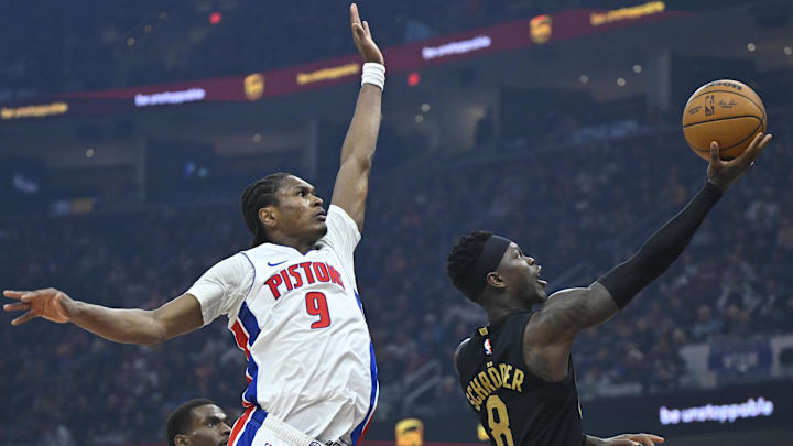 Mar 3, 2026; Cleveland, Ohio, USA; Cleveland Cavaliers guard Dennis Schroder (8) lays up a shot beside Detroit Pistons guard Ausar Thompson (9) in the third quarter at Rocket Arena. Mandatory Credit: David Richard-Imagn Images
