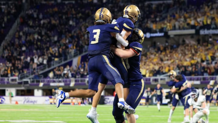 Chanhassen players celebrate the 2023 Class 5A championship