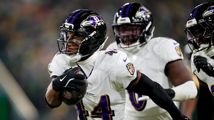 Dec 27, 2025; Green Bay, Wisconsin, USA; Baltimore Ravens cornerback Marlon Humphrey (44) reacts after intercepting a pass during the fourth quarter against the Green Bay Packers at Lambeau Field. Mandatory Credit: Kayla Wolf-Imagn Images
