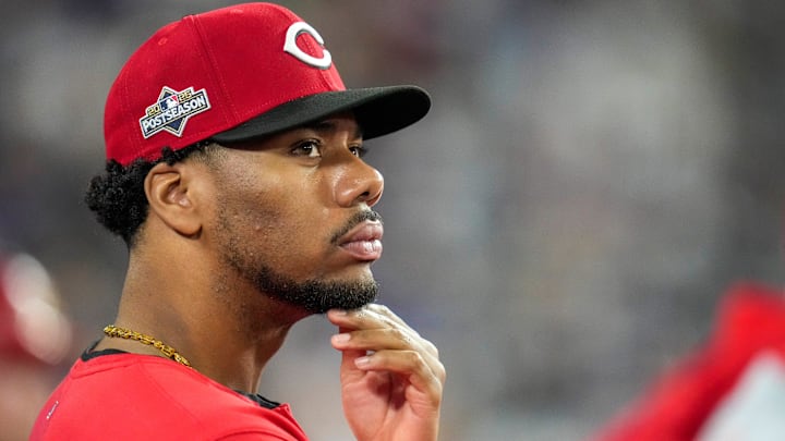 Cincinnati Reds pitcher Hunter Greene (21) watches from the dugout in the eighth inning of the MLB National League Wild Card Game 2 between the Los Angeles Dodgers and the Cincinnati Reds at Dodger Stadium in Los Angeles on Wednesday, Oct. 1, 2025. The Reds were eliminated from the postseason with an 8-4 loss to the reining World Series Champions La Dodgers.