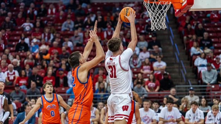Wisconsin Badgers junior Nolan Winter slams home two points against the UW-Platteville Pioneers in an exhibition game at the Kohl Center on October 29, 2025. Wisconsin Badgers junior Nolan Winter slams home two points against the UW-Platteville Pioneers in an exhibition game at the Kohl Center on October 29, 2025.