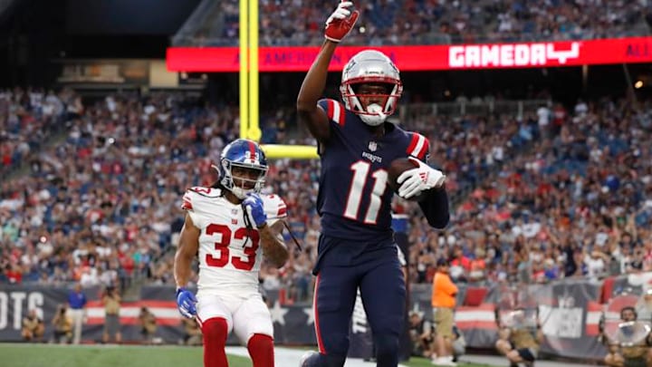 New England Patriots wide receiver Tyquan Thornton (11) celebrates his touchdown, in front of New York Giants cornerback Aaron Robinson (33) during first half of a preseason NFL football game Thursday, Aug. 11, 2022, in Foxborough, Mass. (AP Photo/Michael Dwyer) New England Patriots wide receiver Tyquan Thornton (11) celebrates his touchdown, in front of New York Giants cornerback Aaron Robinson (33) during first half of a preseason NFL football game Thursday, Aug. 11, 2022, in Foxborough, Mass. (AP Photo/Michael Dwyer)