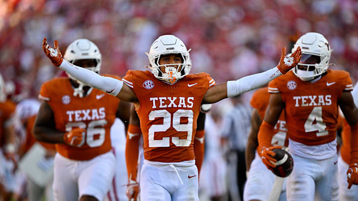 Oct 11, 2025; Dallas, Texas, USA; Texas Longhorns defensive back Graceson Littleton (29) celebrates after he intercepts a pass from Oklahoma Sooners quarterback John Mateer (not pictured) during the second half at the Cotton Bowl. Mandatory Credit: Jerome Miron-Imagn Images
