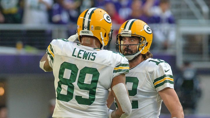 Green Bay Packers quarterback Aaron Rodgers and tight end Marcedes Lewis in action against the Minnesota Vikings.