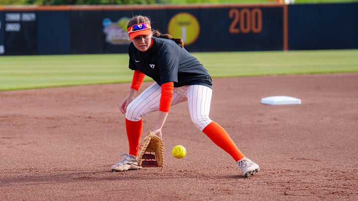 Michelle Chatfield takes grounders pregame at Tech Softball Park.
