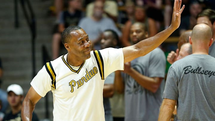 Frank Kendrick waves to the audience as he is introduced at the start of the Purdue Alumni basketball game