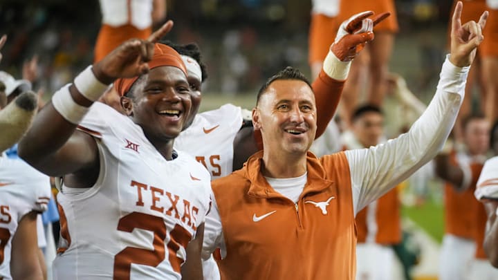 Texas head coach Steve Sarkisian and Texas defensive back Jelani McDonald (25) celebrate a win over Baylor 38-6 of an NCAA college football game, Saturday, Sept. 23, 2023, in Waco, Texas.