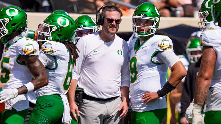 Oregon head coach Dan Lanning talks to Oregon quarterback Dylan Raiola. Oregon head coach Dan Lanning talks to Oregon quarterback Dylan Raiola.