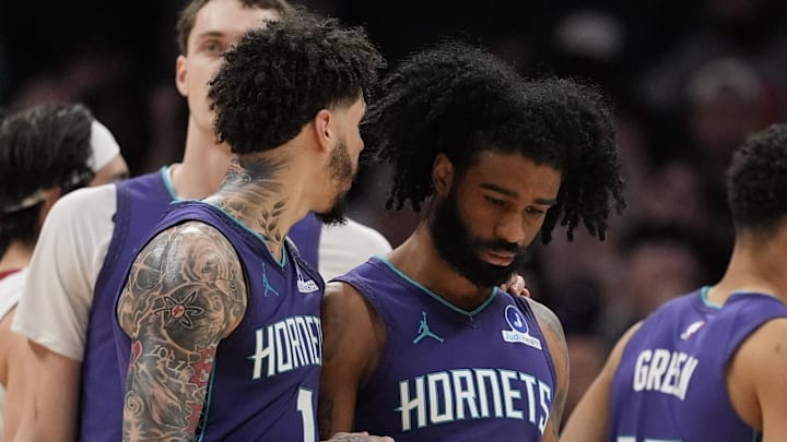 Charlotte Hornets guard LaMelo Ball (1) talks with guard Coby White (3) after a three point play Charlotte Hornets guard LaMelo Ball (1) talks with guard Coby White (3) after a three point play