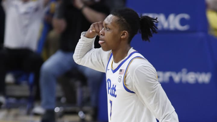 Mar 9, 2024; Pittsburgh, Pennsylvania, USA;  Pittsburgh Panthers guard Carlton Carrington (7) reacts after making a three point basket against the North Carolina State Wolfpack during the second half at the Petersen Events Center. The Panthers won 81-73. Mandatory Credit: Charles LeClaire-USA TODAY Sports