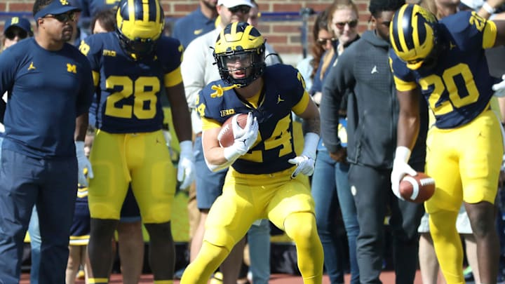Michigan Wolverines running back Cole Cabana (24) warms up before action against the Rutgers Scarlet Knights in Ann Arbor, Michigan on Saturday, Sept. 23 2023.