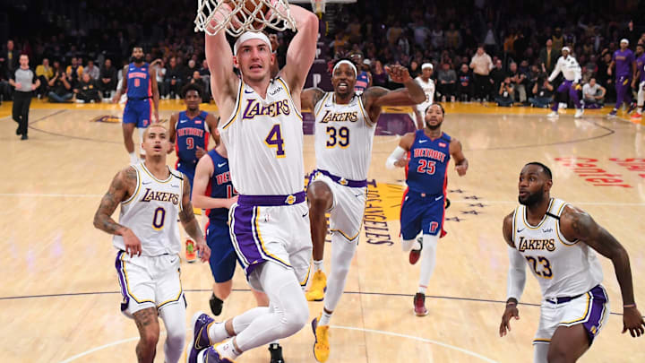 Jan 5, 2020; Los Angeles, California, USA;  Los Angeles Lakers center Dwight Howard (39) and forward LeBron James (23) react as guard Alex Caruso (4) goes up for a dunk in the second half against the Detroit Pistons at Staples Center. Mandatory Credit: Jayne Kamin-Oncea-Imagn Images