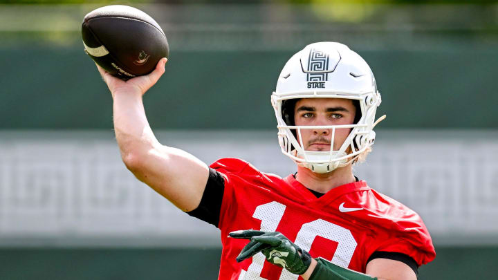 Michigan State quarterback Tommy Schuster throws a pass during the first day of football camp on Tuesday, July 30, 2024, in East Lansing. Michigan State quarterback Tommy Schuster throws a pass during the first day of football camp on Tuesday, July 30, 2024, in East Lansing.