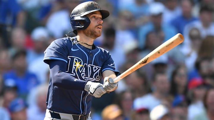 Sep 13, 2025; Chicago, Illinois, USA; Tampa Bay Rays second baseman Brandon Lowe (8) hits an RBI single against the Chicago Cubs during the sixth inning at Wrigley Field.