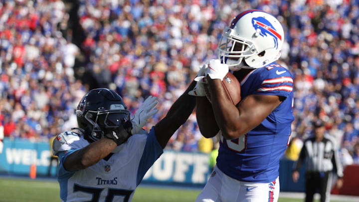 Bills Amari Cooper hauls in a pass and keeping Titans Jarvis Brownlee Jr. from stripping it from him during second half action at Highmark Stadium in Orchard Park on Oct. 20, 2024.