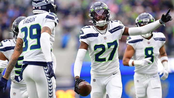 Dec 4, 2022; Inglewood, California, USA; Seattle Seahawks cornerback Tariq Woolen (27) celebrates after intercepting a pass intended for Los Angeles Rams running back Kyren Williams (23) during the first half at SoFi Stadium. Dec 4, 2022; Inglewood, California, USA; Seattle Seahawks cornerback Tariq Woolen (27) celebrates after intercepting a pass intended for Los Angeles Rams running back Kyren Williams (23) during the first half at SoFi Stadium.