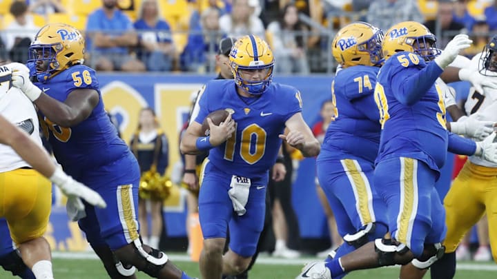 Oct 12, 2024; Pittsburgh, Pennsylvania, USA;  Pittsburgh Panthers quarterback Eli Holstein (10) runs the ball against the California Golden Bears during the fourth quarter at Acrisure Stadium. Pittsburgh won 17-15. Mandatory Credit: Charles LeClaire-Imagn Images