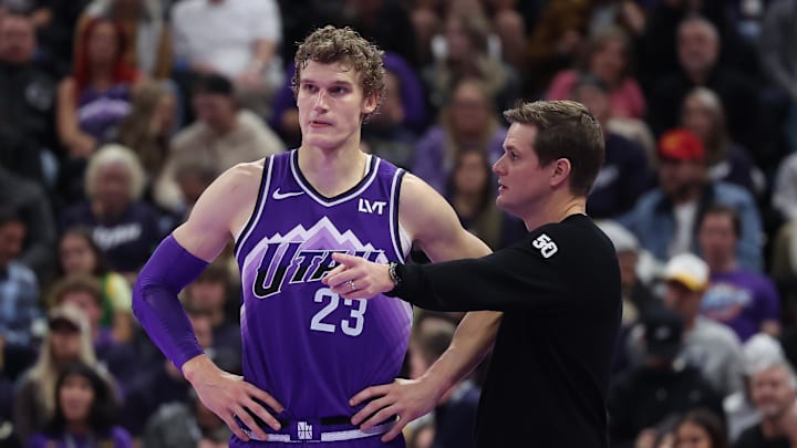 Nov 17, 2023; Salt Lake City, Utah, USA; Utah Jazz forward Lauri Markkanen (23) and head coach Will Hardy speak while the Phoenix Suns shoot free throws in the fourth quarter at Delta Center. Mandatory Credit: Rob Gray-Imagn Images